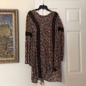 Long sleeve patterned dress.